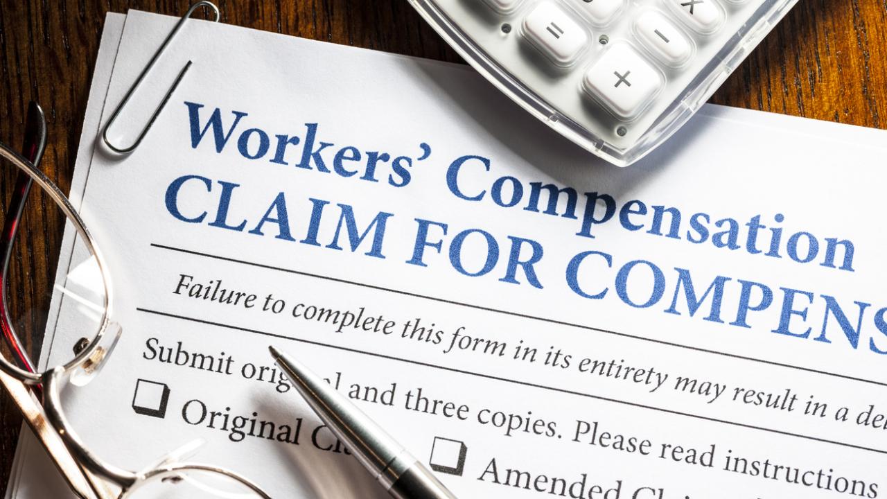 Image of a workers&#039; compensation form on a desk. 