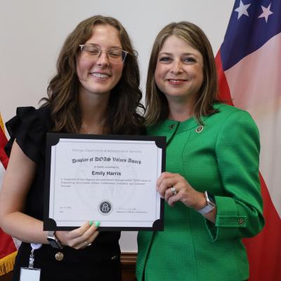 Emily Harris receives a Display of DOAS Values Award from Commissioner Rebecca Sullivan.