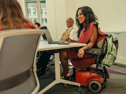 Woman in wheelchair in office