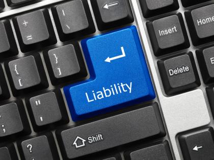 Image of a computer keyboard with a key marked &quot;LIABILITY.&quot;