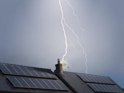 Image of lightning striking a house.