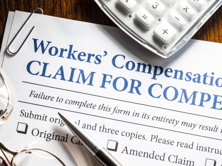 Image of a worker&#039;s compensation form on a desk. 
