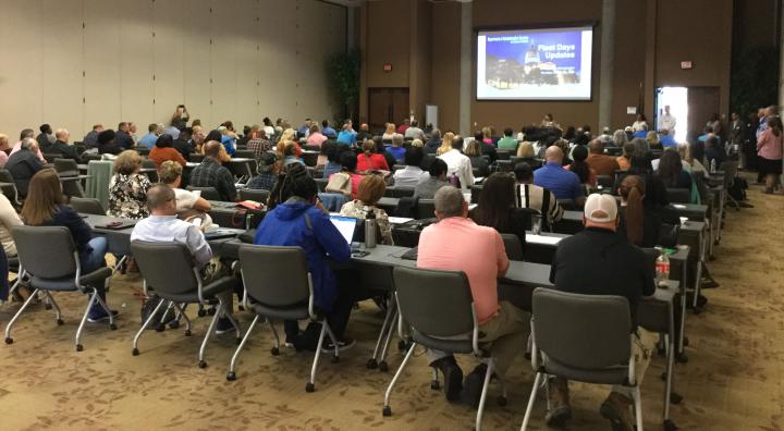 Large conference room filled with participants